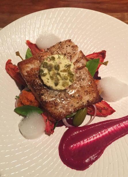 Pan seared local kingfish with slow roasted roma tomatoes, baby beetroots and semidried tomato and macadamia pesto garden herbs, caper and dill butter at Arajilla Lodge.